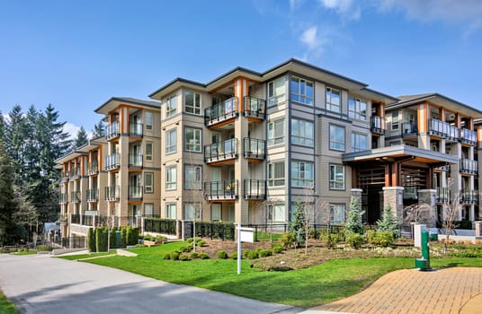 New apartment building on sunny day in British Columbia, Canada.