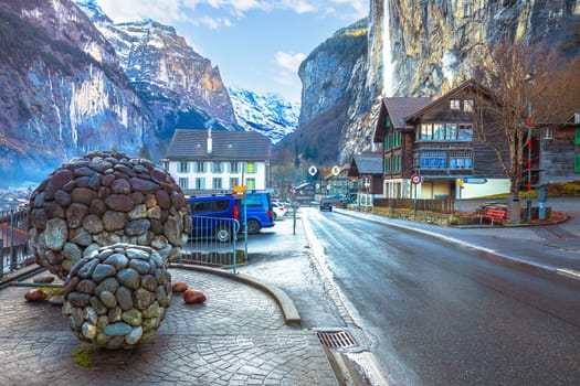 Scenic town of Lauterbrunnen by Swiss Alps cliffs street view, Switzerland