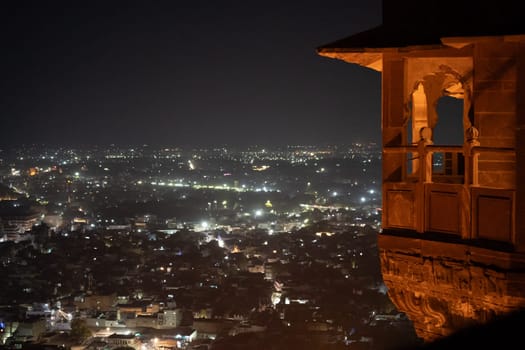 Night shot showing mehrangarh fort terrace balcony overlooking the lights of Jodhpur city in India