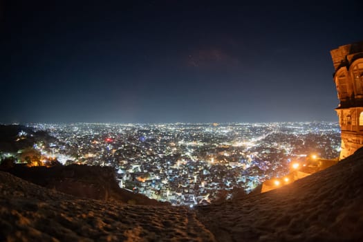 Fisheye shot of jodhpur city lights at night showing the cityscape from the roof of mehrangarh fort in India