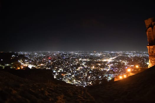 Fisheye shot of jodhpur city lights at night showing the cityscape from the roof of mehrangarh fort in India