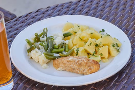 Photo fried potatoes, cutlet, cauliflower and string beans. Serving lunch . Supper.Healthy eating.