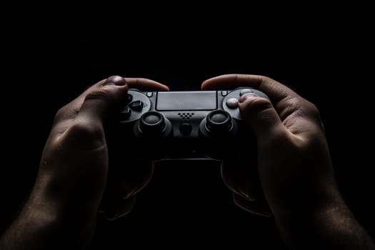 Game controller in hands photo in low key ai generated image