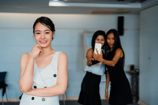 Young Asian businesswomen standing in office. Business friends and community concept. uds