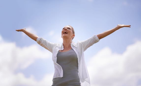 Happy woman, freedom and joy with open arms for success, health and wellness with blue sky background. Female person with smile in relax for achievement, accomplishment or winning on mockup space.