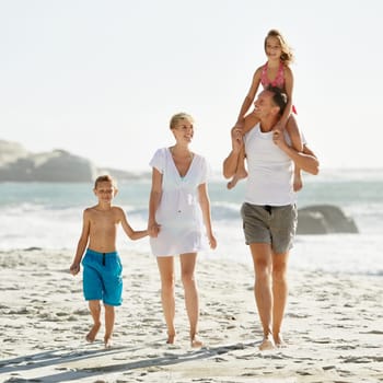 Parents, children and happiness for bonding at beach on vacation, summer and smile in Florida. Family, kids and hot weather with laugh for travel on vacation, trip and break at sea for care