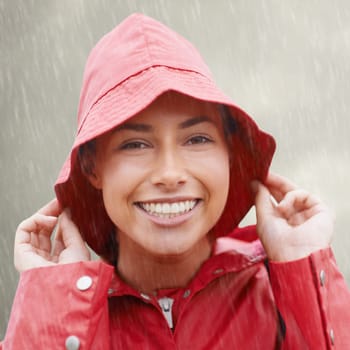 Woman, portrait and raincoat for protection, outdoor nature and waterproof jacket for rain in weather. Female person, happy and safety or shield from cold, winter and travel to Scotland for holiday.