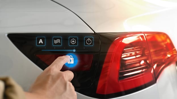 Man pressing unlock key button icon, opened charging socket cap of an electric car.