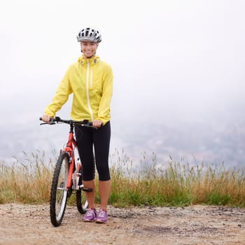 Portrait, smile and woman with bike in mountains for morning exercise, training or off road hobby. Cycling, fitness and sports with happy young athlete in countryside or nature for workout ride.