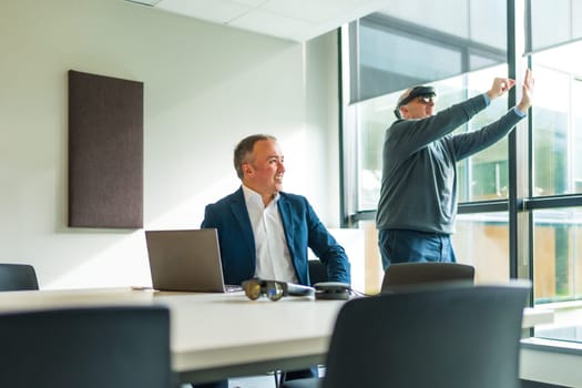 Businessmen wearing smart virtual glasses and joining business meeting on augmented reality metaverse working space