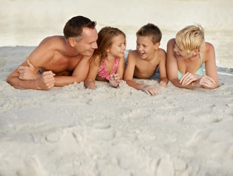 Family, kids and beach with adventure in summer on vacation for bonding and happiness in Florida. Parents, smile and travel for holiday with children to relax, fun and enjoy trip in seaside