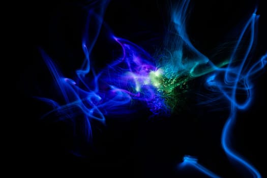 Blue and green light explosion of energy with elegant glowing lines. Abstract technology background. High quality photo