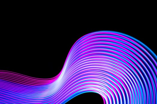 Abstract neon modern pink and blue waves curvy lines on black background. Technology data. High quality photo
