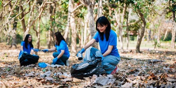 Group of volunteers, community members cleaning the nature from garbage and plastic waste to send it for recycling.