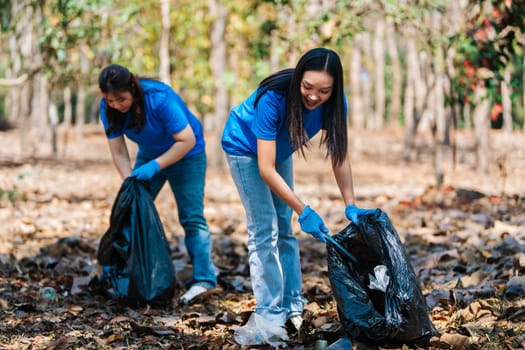 Group of volunteers, community members cleaning the nature from garbage and plastic waste to send it for recycling.