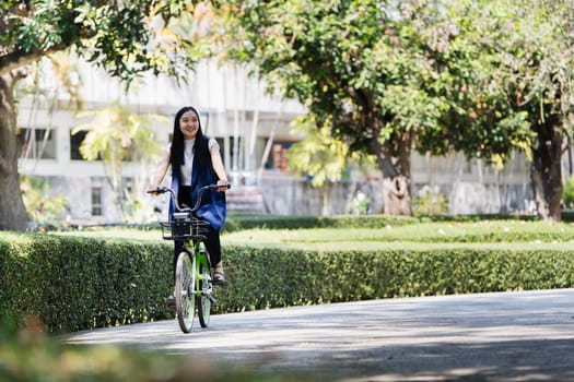 Professional Business woman with bike in the morning walking in the street to work. Eco friendly.