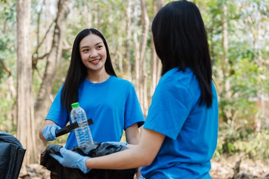 Group of volunteers, community members cleaning the nature from garbage and plastic waste to send it for recycling.