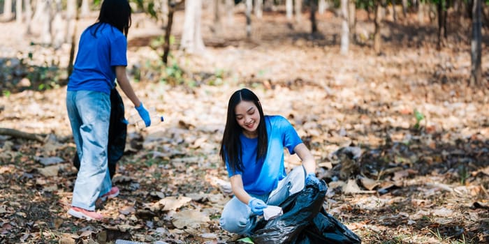 Group of volunteers, community members cleaning the nature from garbage and plastic waste to send it for recycling.