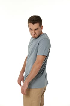 annoyed angry man standing on white studio background