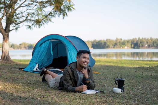 Asian tourists happily spend their free time camping, relaxing, and doing outdoor activities..