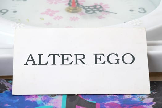 Text Alter ego is translated from Latin as the second self. a real or invented alternative personality of a person. Written on a white business card