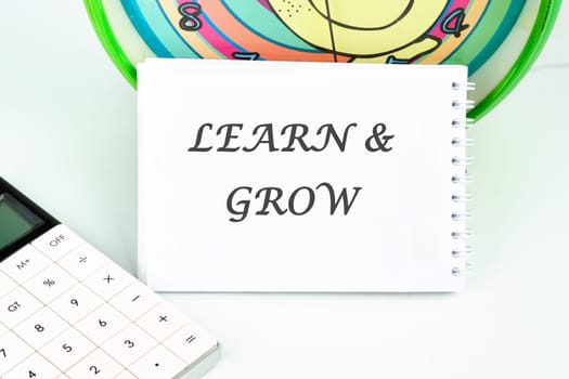 Learn and Grow written on a white card