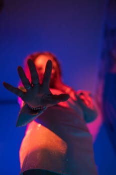 Woman hand closeup with neon color background