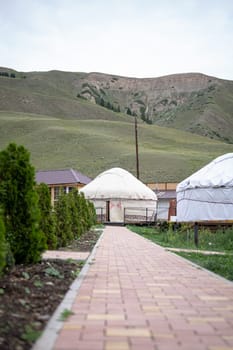 The yurt, a nomadic tent of Central Asia, is round, made of felt or skins, easy to assemble, and portable. Its a traditional dwelling.