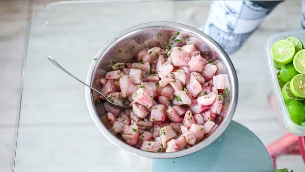 Peruvian food ceviche. 4 Preparation of ceviche, squeezing lemon juice over the ceviche