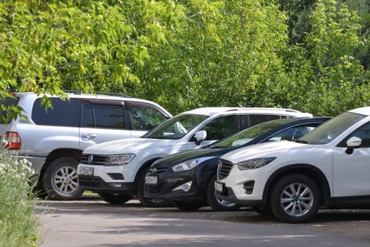 Moscow, Russia - 11 June 2023. Car parking in parking lot near the park