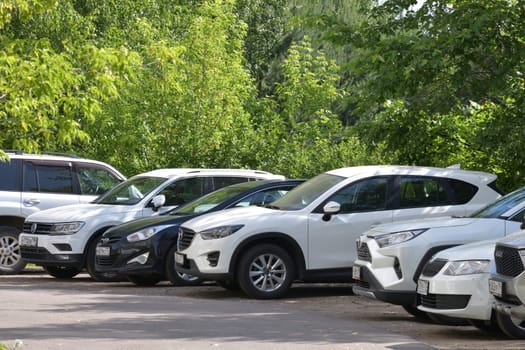 Moscow, Russia - 11 June 2023. Car parking in parking lot near the park