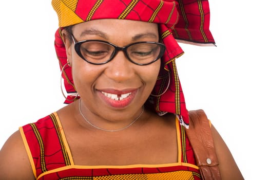 mature woman in loincloth standing on white background smiling.