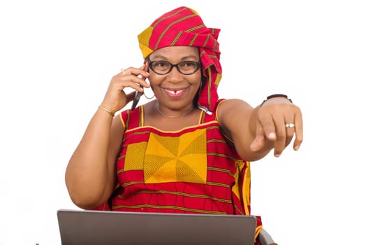 mature woman in loincloth on white background communicating with mobile phone while smiling.