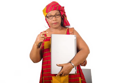 mature businesswoman standing on white background showing laptop.