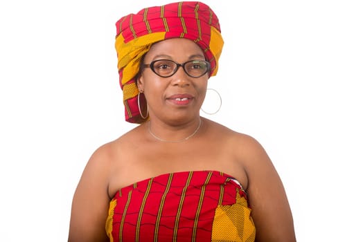 mature woman in glasses standing on white background looking at camera smiling.