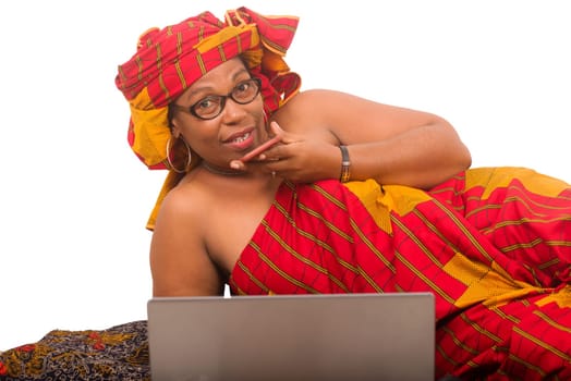 mature woman on white background communicating on cellphone and looking at camera smiling.