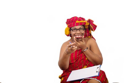 mature woman in loincloth sitting on the floor hand to communicate on mobile phone smiling.