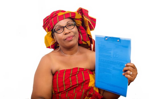 mature woman in loincloth sitting on white background showing a notepad looking at the camera.