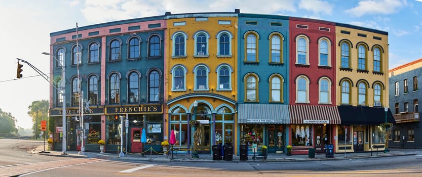 Early morning panorama of colorful historic storefronts in Ypsilanti, Michigan, showcasing quaint charm and serene urban beauty.