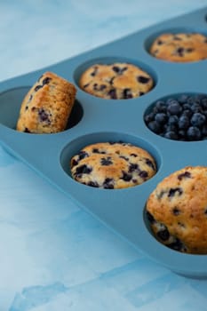 Fresh baked blueberry muffins. Tasty Sweet cupcake. Pastry homemade dessert. Berry pie in silicone muffin tin. Healthy vegan cupcakes with organic berries Baked in reusable silicon forms