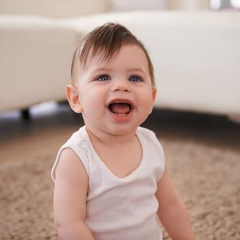 Smile, happy and baby of floor of living room in home for growth, child development or curiosity. Children, life and youth with infant boy kid sitting on carpet in apartment for innocent wonder.