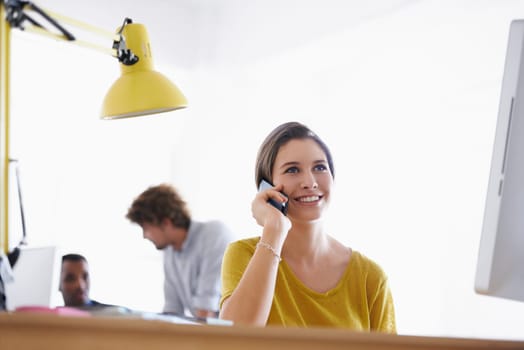 Businesswoman, thinking and phone call in office by desk, communication and networking with ambition in career. Entrepreneur, smartphone and happy with planning and talking of deal in small business.