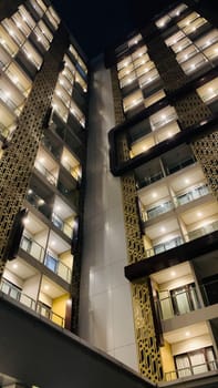 Tall building perspective during night time, business background, business template background, presentation background for your creative content creation