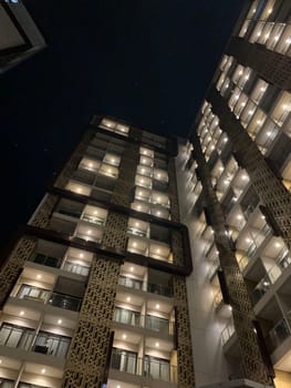 Tall building perspective during night time, business background, business template background, presentation background for your creative content creation