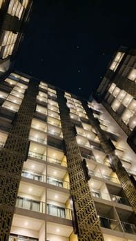 Tall building perspective during night time, business background, business template background, presentation background for your creative content creation