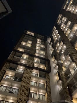 Tall building perspective during night time, business background, business template background, presentation background for your creative content creation