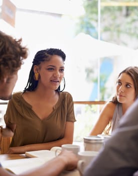 Students, conversation and studying in coffee shop with books or friends for university education, course or learning. Man, woman and collaboration in cafe for scholarship, college or brainstorming.