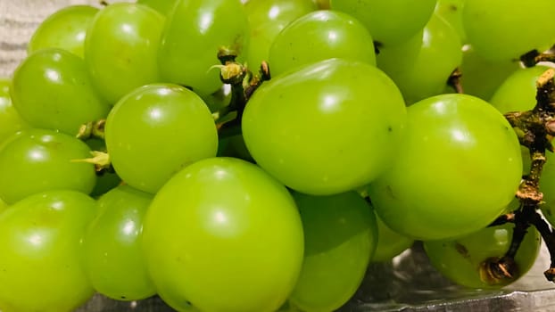 seedless green Shine Muscat grape background in a container. Japanese grapes. white grapes local produce