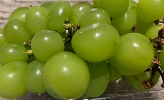 seedless green Shine Muscat grape background in a container. Japanese grapes. white grapes local produce