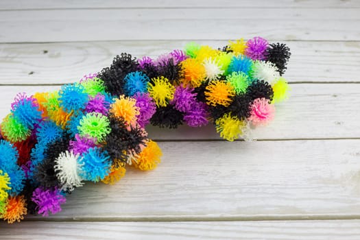 Velcro construction set with colored balls with hooks, multi colored burdocks made of plastic for children development